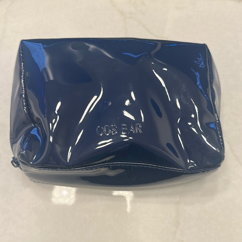 New/ unused. Blue cos bar makeup bag.